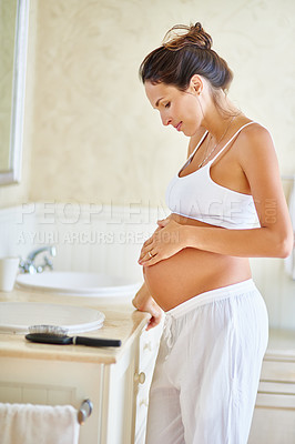 Buy stock photo Shot of a pregnant woman holding her belly