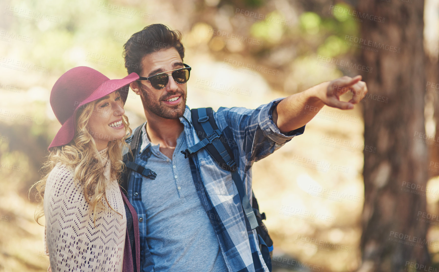 Buy stock photo Smile, couple and pointing in outdoor for hiking or bird watching on vacation for explore, adventure or journey. Man, woman and together in forest or nature on travel holiday in New Zealand with love