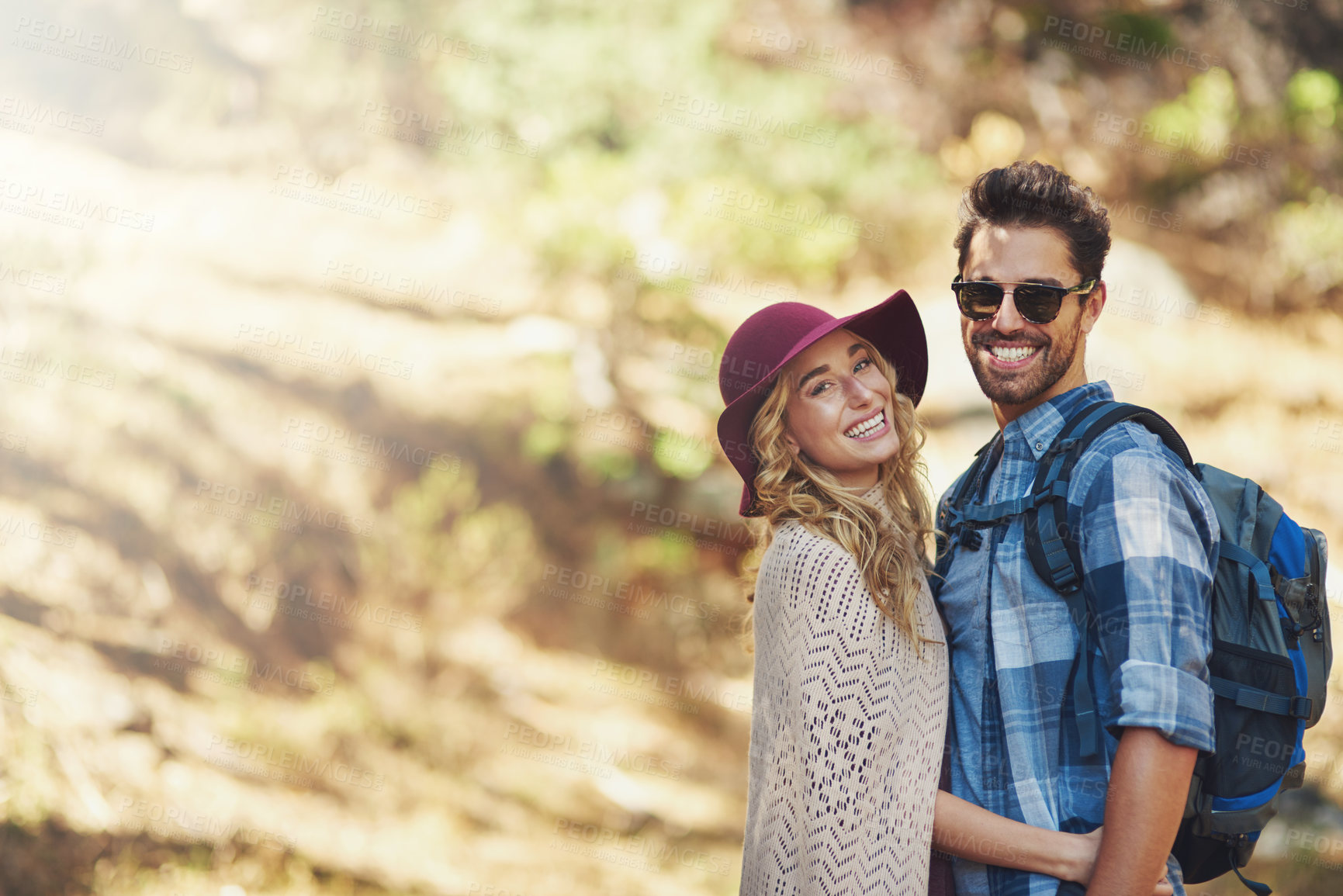 Buy stock photo Hug, couple and portrait outdoor for hiking in nature on vacation, together and walking in forest for adventure. Man, woman and smile in woods for explore on travel holiday in New Zealand with space.