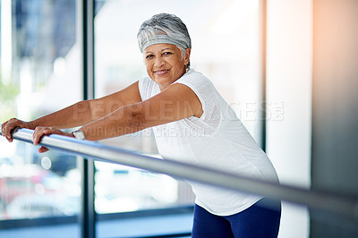 Buy stock photo Shot of a senior woman working out indoors