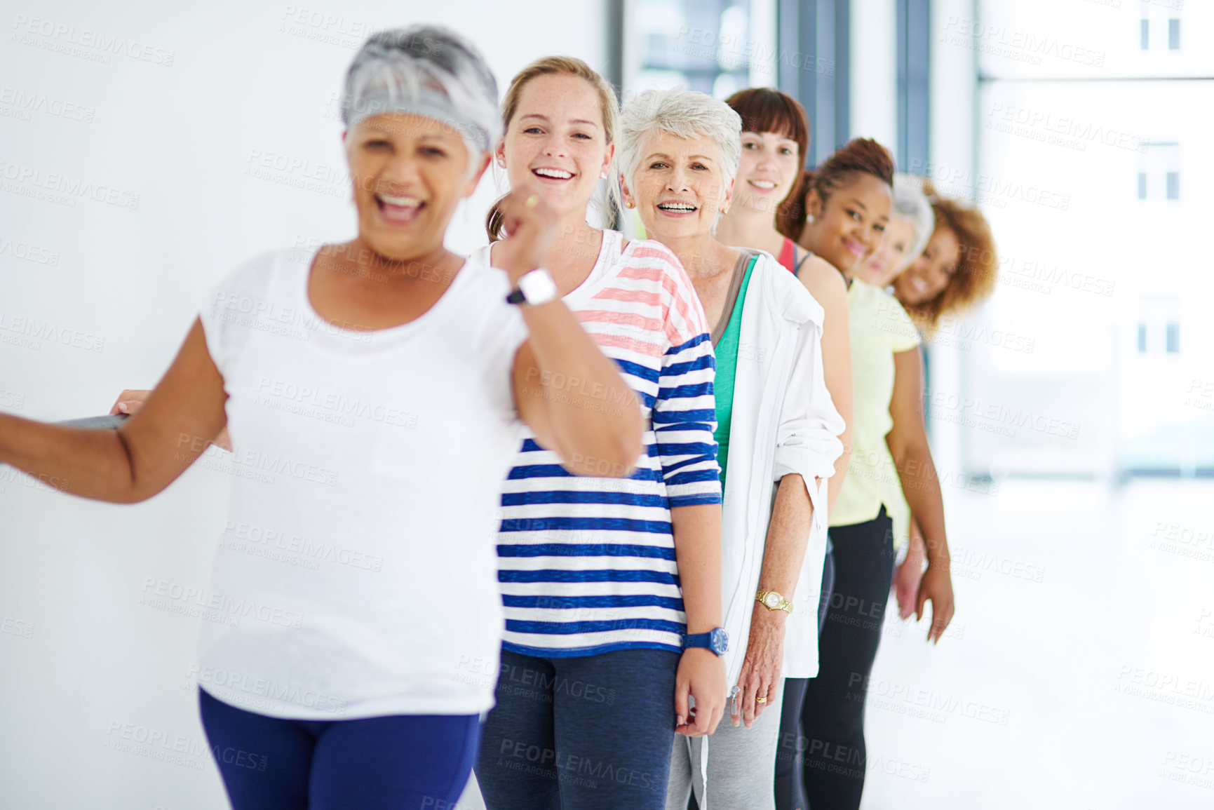 Buy stock photo Shot of a group of women working out indoors