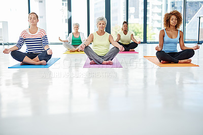 Buy stock photo Shot of a group of women meditating indoors