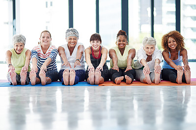 Buy stock photo Shot of a group of women warming up indoors