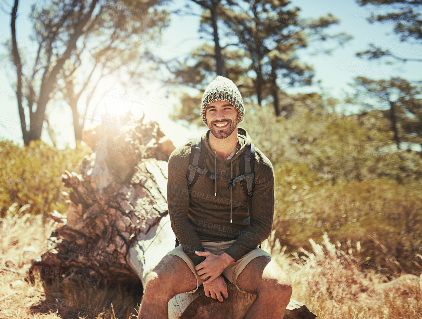 Buy stock photo Portrait, man and relax from hiking outdoor with back for fitness, travel adventure or trekking location in nature. Smile, male person and break for cardio exercise, sustainable vacation and wellness