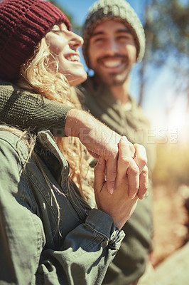 Buy stock photo Cropped shot of an affectionate young couple hiking