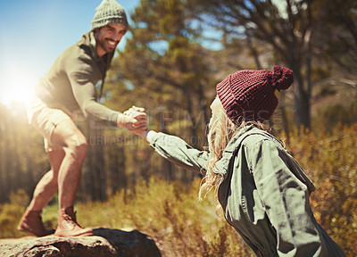 Buy stock photo Cropped shot of a young couple hiking
