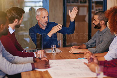 Buy stock photo Shot of businesspeople having a meeting in an office