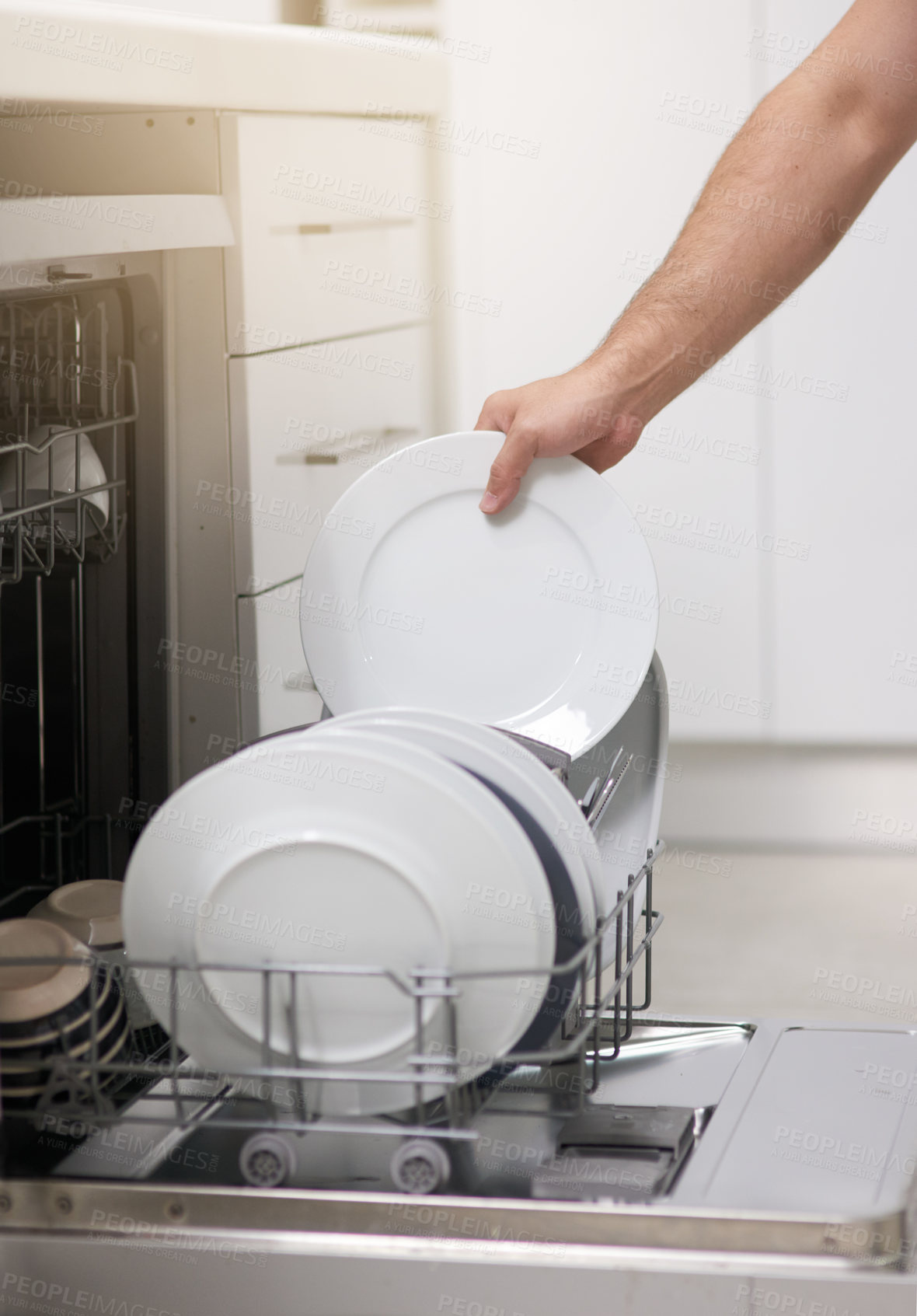 Buy stock photo Cleaning, loading dishwasher and hands with plates in the kitchen for housework and responsibility. Lifestyle, morning and a person doing housekeeping, organizing crockery and clean equipment