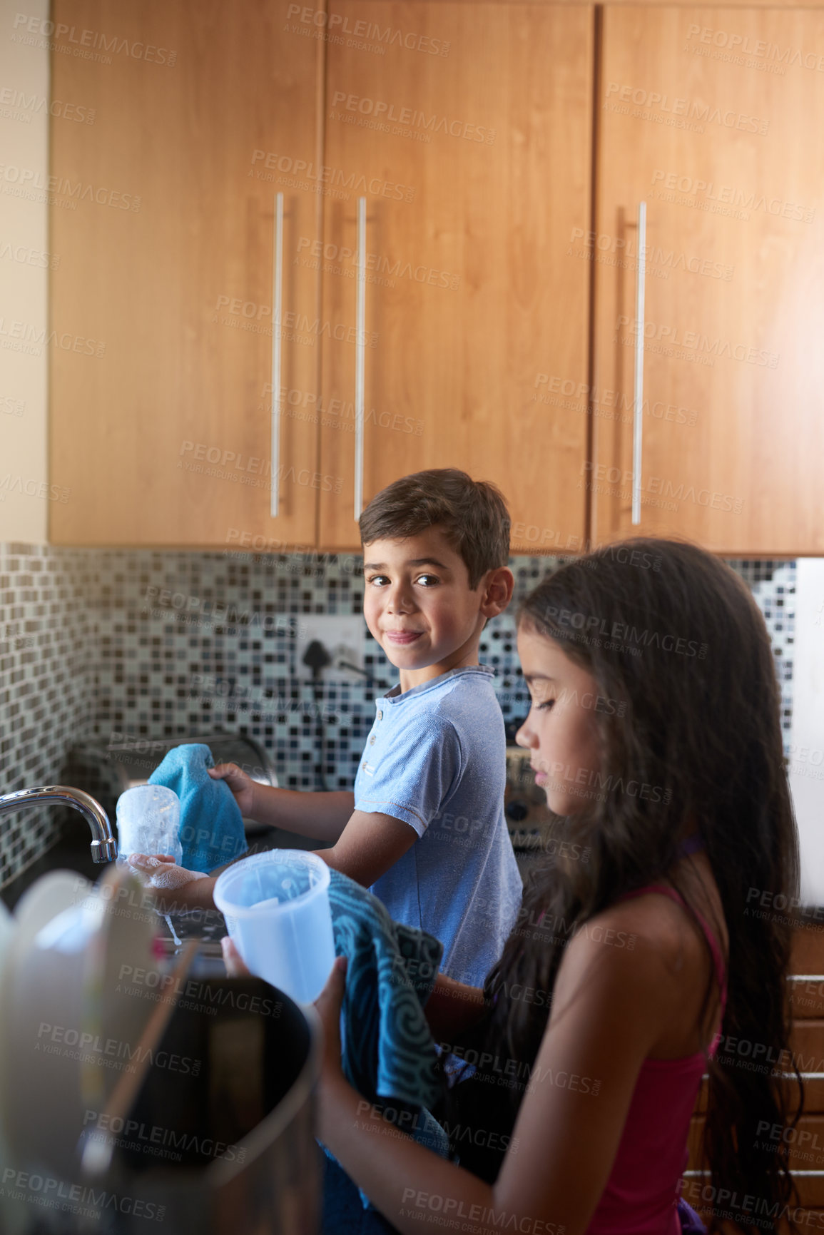 Buy stock photo Boy, girl and cleaning in kitchen for development, children and learning teamwork in house. Kids, collaboration and happy together for helping, hygiene and spring cleaning in family home for care