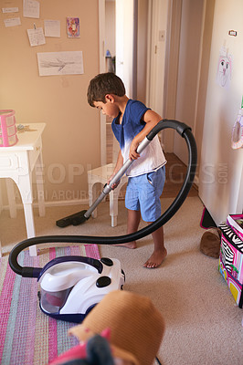 Buy stock photo Shot of a little boy vacuuming his bedroom at home