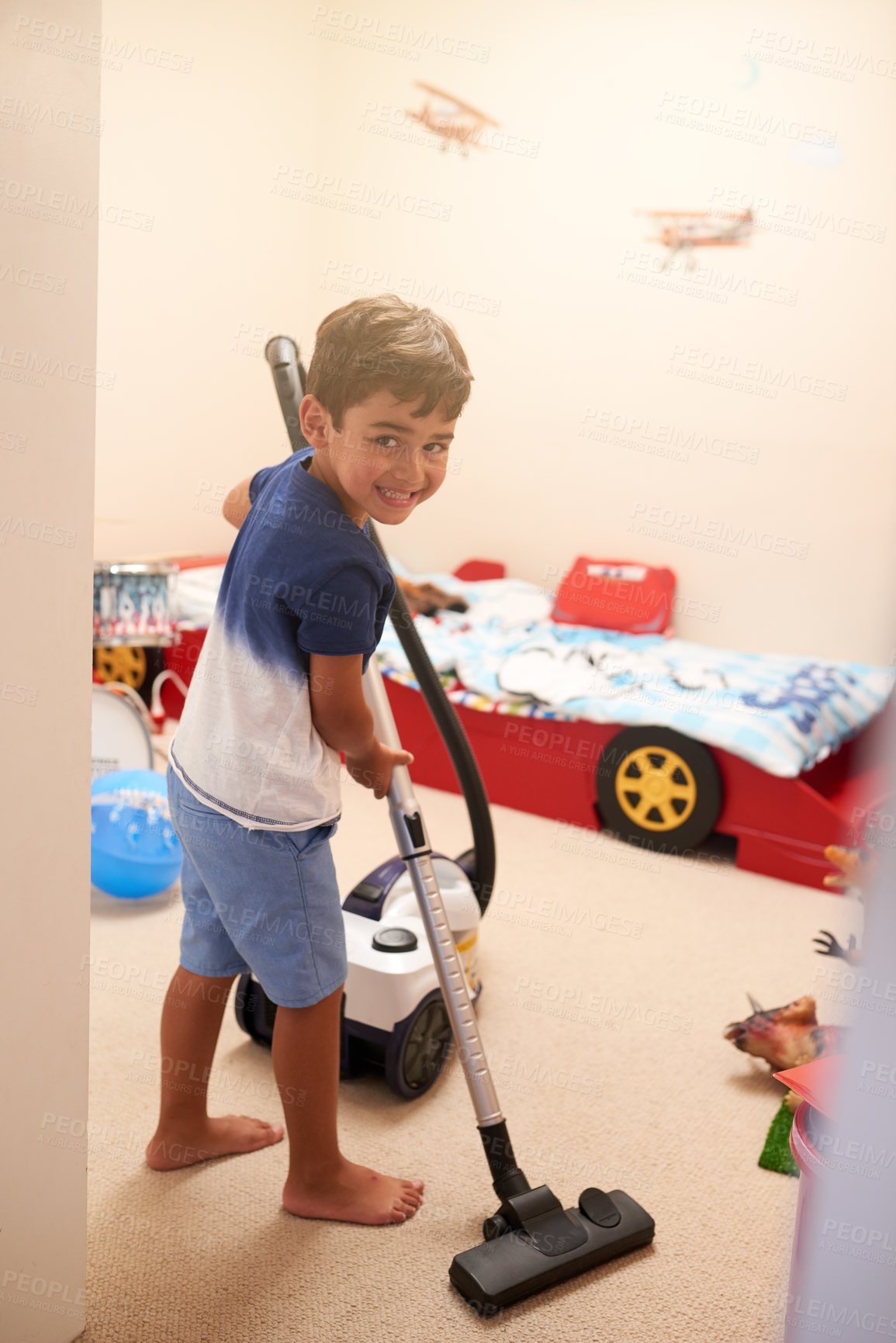 Buy stock photo Shot of a little boy vacuuming his bedroom at home