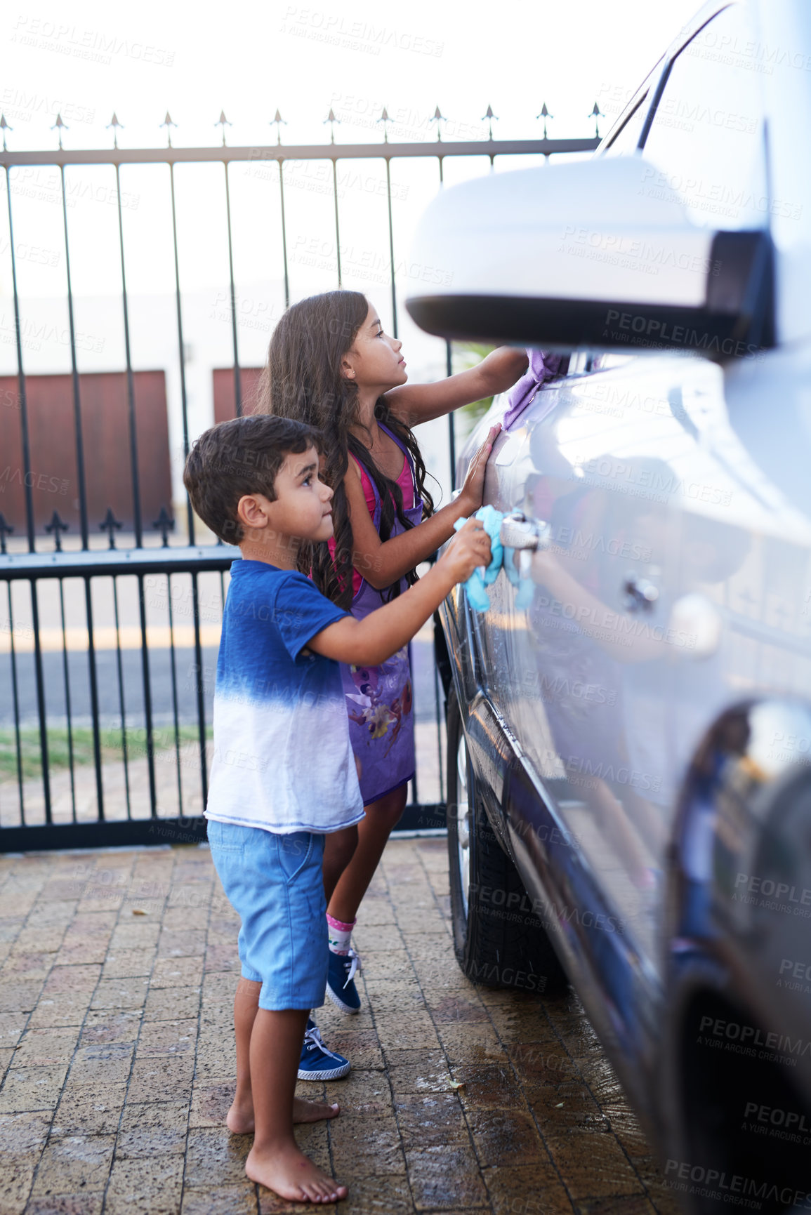 Buy stock photo Children, car wash and helping siblings or outdoor together for to do list, discipline or teamwork. Boy, girl and cloth at transport in home driveway for cleaning responsibility, learning or task