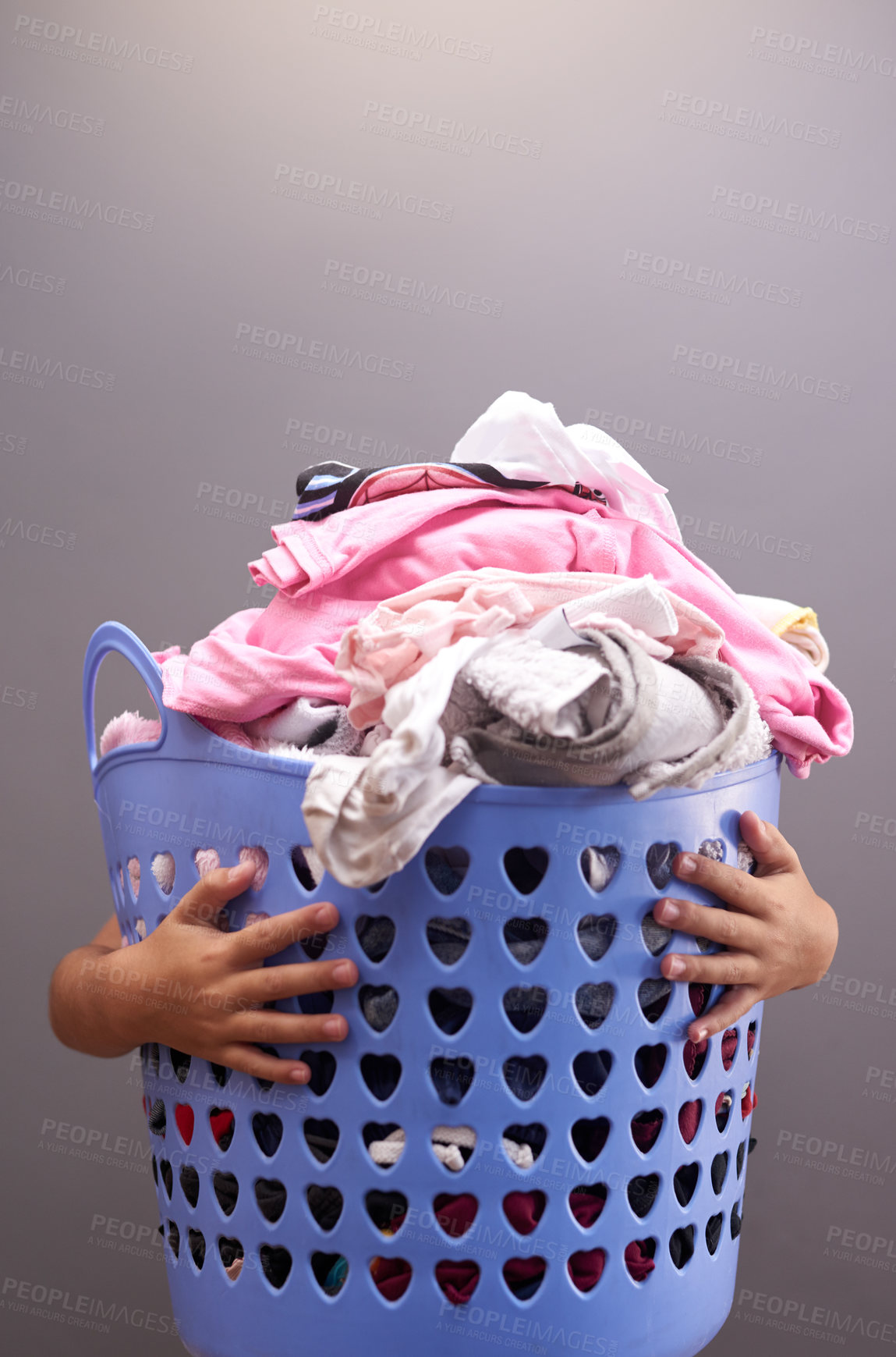 Buy stock photo Laundry, child and basket in family home for development, cleaning and helping in apartment. Hands, kid and cleaning service for clothes and linen in house for learning, support and household chores.