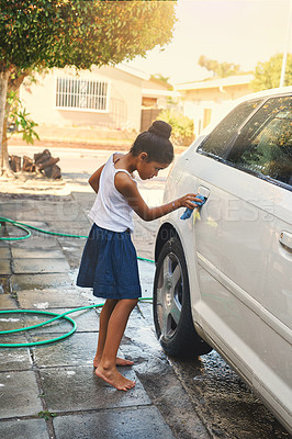 Buy stock photo Polish, car and girl cleaning in driveway with water, soap and cloth at home. Happy kid, washing and vehicle at home for helping, polishing and learning lessons for responsibility in backyard