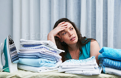 Buy stock photo Laundry, stress headache and woman in home with mess, clothes and clutter in apartment. Spring cleaning, chaos and frustrated female person with anger, fatigue and burnout for washing crisis in house