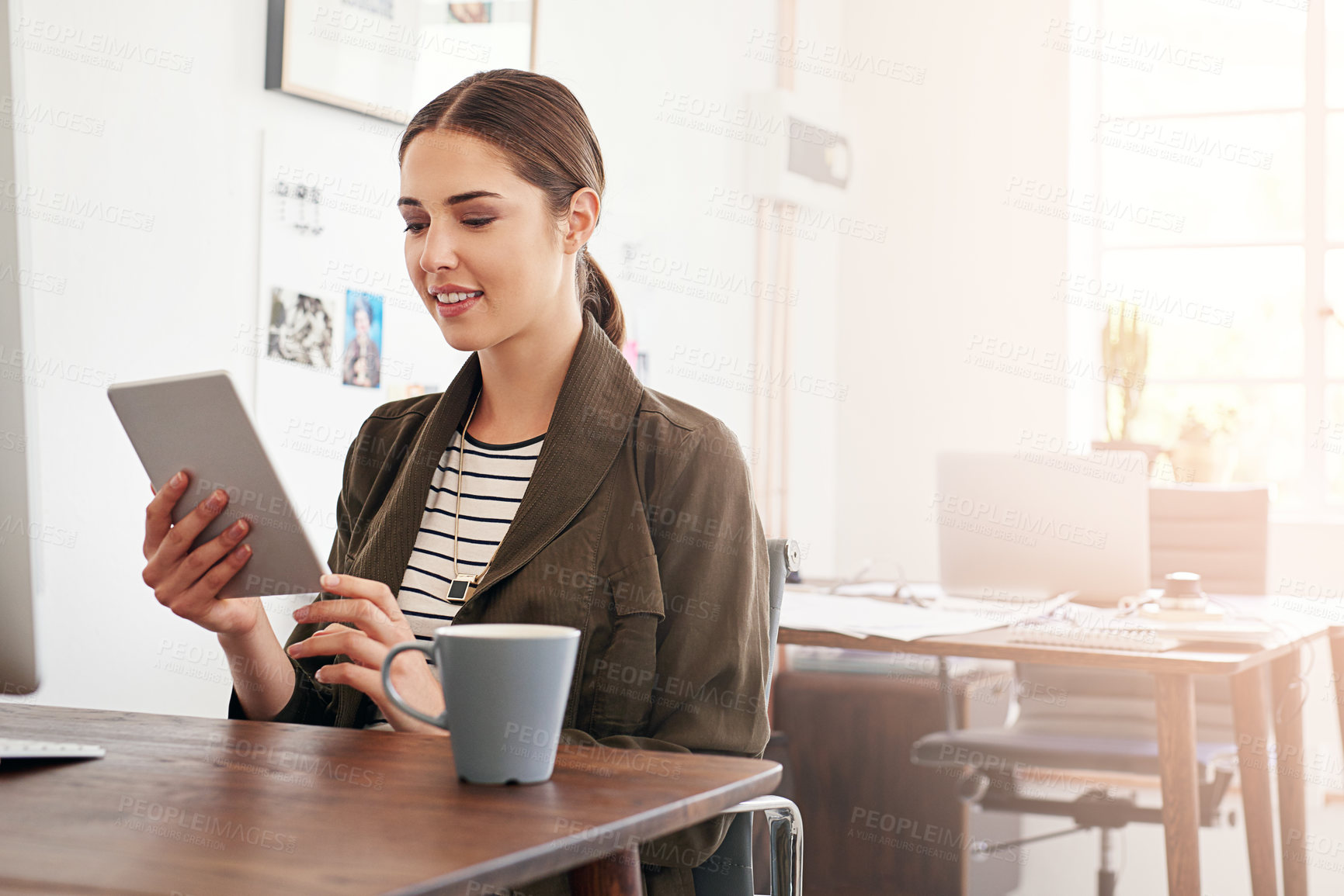 Buy stock photo Cropped shot of a young businesswoman working in her office