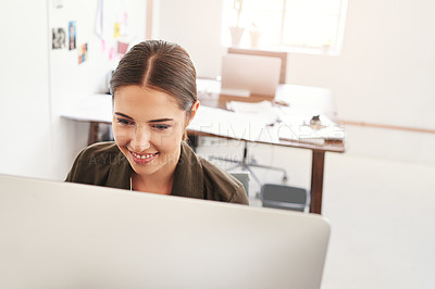 Buy stock photo Cropped shot of a young businesswoman working in her office