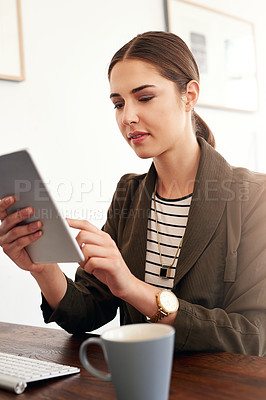 Buy stock photo Cropped shot of a young businesswoman working in her office