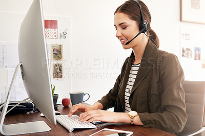 Buy stock photo Headset, computer and agent with woman typing in office for travel consultant, customer service or crm. Flight package, hotel booking or airline contact with person for help desk, search and smile