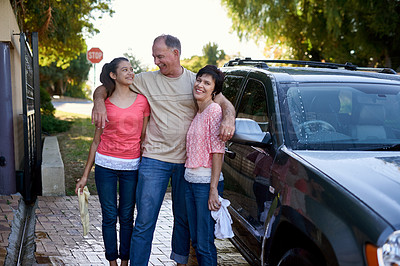 Buy stock photo Outdoor, hug and family washing car, bonding together and hobby with fun chore, cloth or happiness. Portrait, driveway or parents teaching daughter responsibility, clean vehicle or water with hygiene