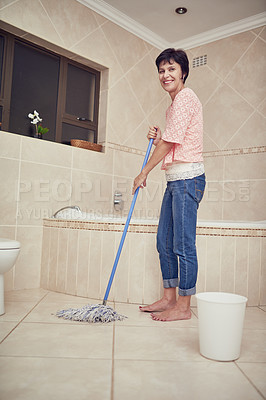 Buy stock photo Portrait of a woman mopping a bathroom floor