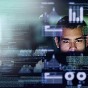 Looking through the source code | Buy Stock Photo on PeopleImages ...