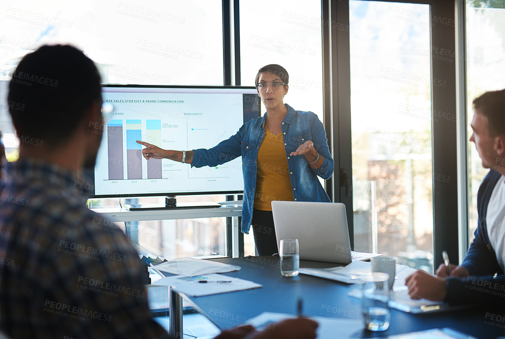 Buy stock photo Cropped shot of a young businesswoman giving a presentation in the boardroom