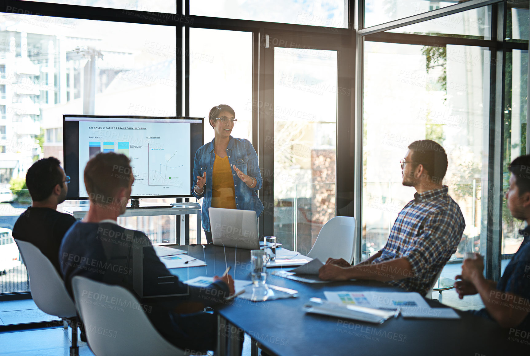 Buy stock photo Cropped shot of a young businesswoman giving a presentation in the boardroom