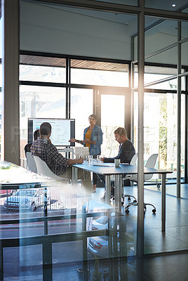 Buy stock photo Shot of a young businesswoman giving a presentation in the boardroom