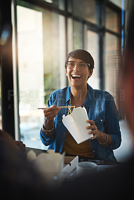 Buy stock photo Shot of a group of colleagues eating while having a meeting in the boardroom