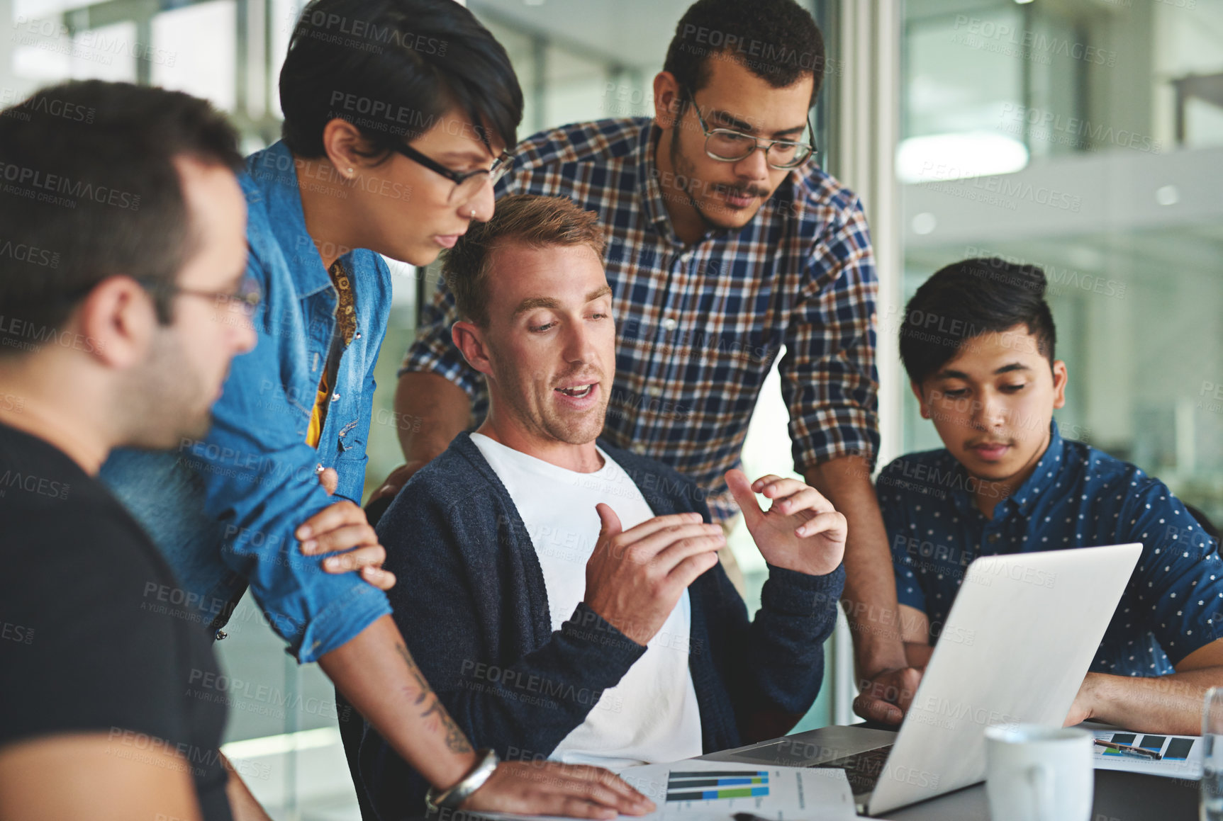 Buy stock photo Shot of a group of colleagues having a meeting in the boardroom 