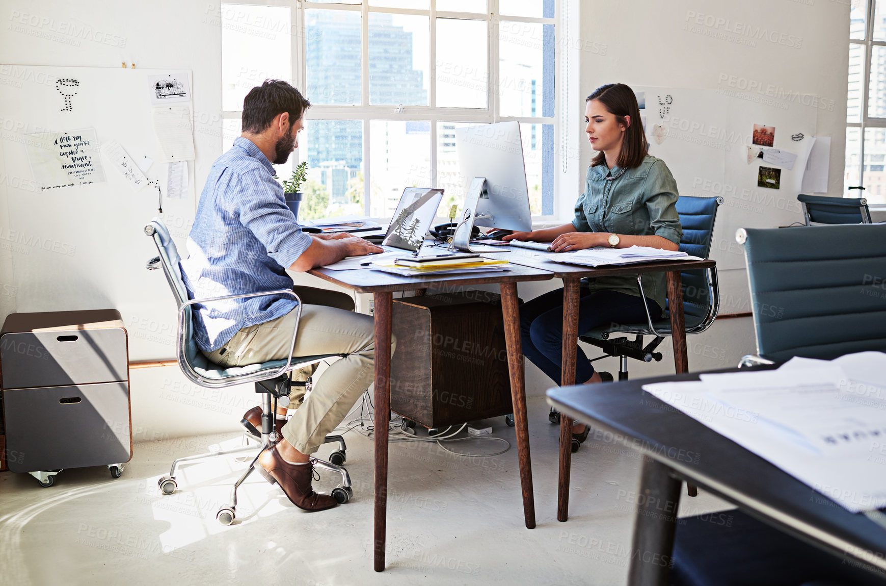Buy stock photo Collaboration, concentration and business people at creative agency, team planning and working together on startup project. Teamwork, computer with man and woman at design office or coworking space