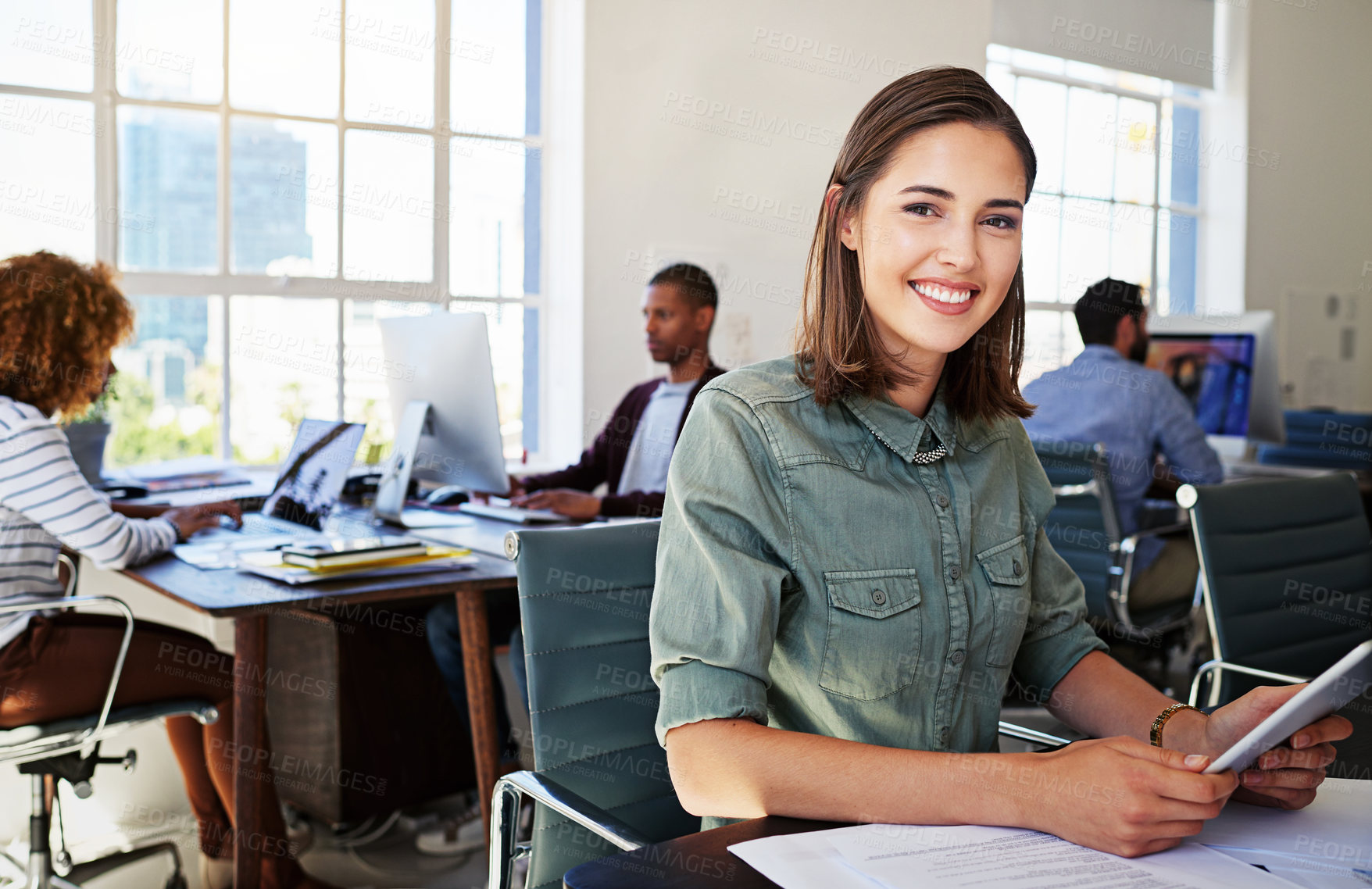 Buy stock photo Portrait of woman in creative agency with smile, confidence and success at design startup. Happy designer in modern office, manager or team leader working at laptop at desk with digital technology.