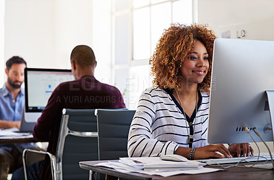 Buy stock photo Shot of colleagues working on their computers in an open plan office