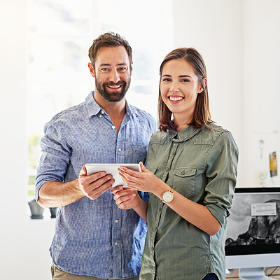 Buy stock photo Portrait of coworkers using a digital tablet in a modern office