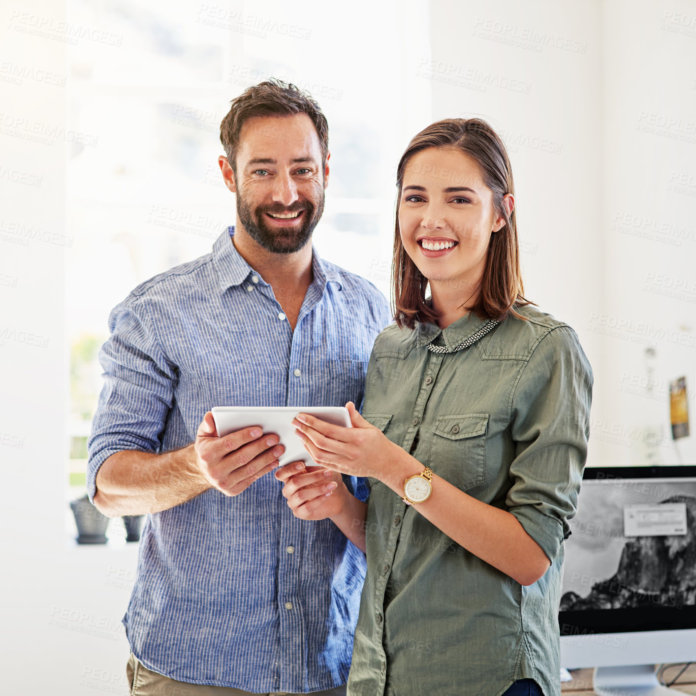 Buy stock photo Portrait of coworkers using a digital tablet in a modern office