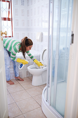 Buy stock photo Cleaning, woman and toilet for hygiene in home with spray bottle, bacteria removal and house chores. Female person, scrub and disinfect in bathroom for dirt with yellow gloves, cloth and OCD disorder