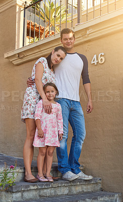 Buy stock photo Family, portrait and real estate with people on wall of home together for growth or investment. Stairs, smile or happy with mom, dad and daughter outdoor at residential property for moving house