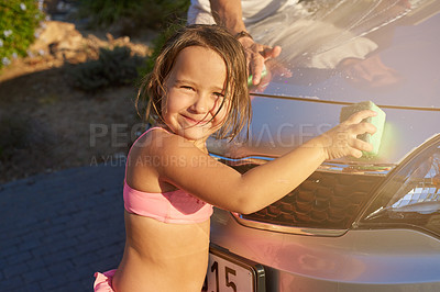 Buy stock photo Child, car wash and portrait with helping for fun in summer for development with learning, smile and family. Cleaning, water and happy with soap on weekend with relax for bonding with relationship