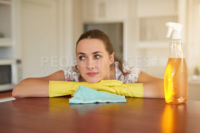 Buy stock photo Thinking, relax and cleaning with woman in kitchen, countertop and bottle for disinfectant and bacteria. Person, cleaner and girl with cloth, relaxing and calm with daily activity or household chores