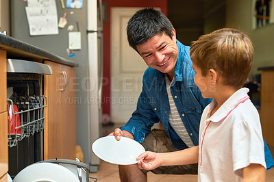 Buy stock photo Father, son and learning or helping with dishwasher for discipline, support and responsibility at home. Dad, family and kid or child with plate and dirty dishes for cleaning and teaching in kitchen