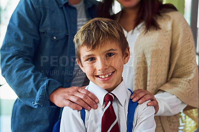 Buy stock photo Shot of a young schoolboy standing with his parents