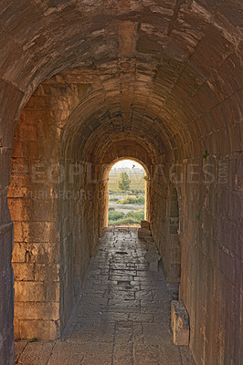 Buy stock photo Travel, tunnel and ancient architecture as history, old building and wallpaper at destination. Landmark, monument and empire with tourism, culture and art for discovery, adventure and site in Greece