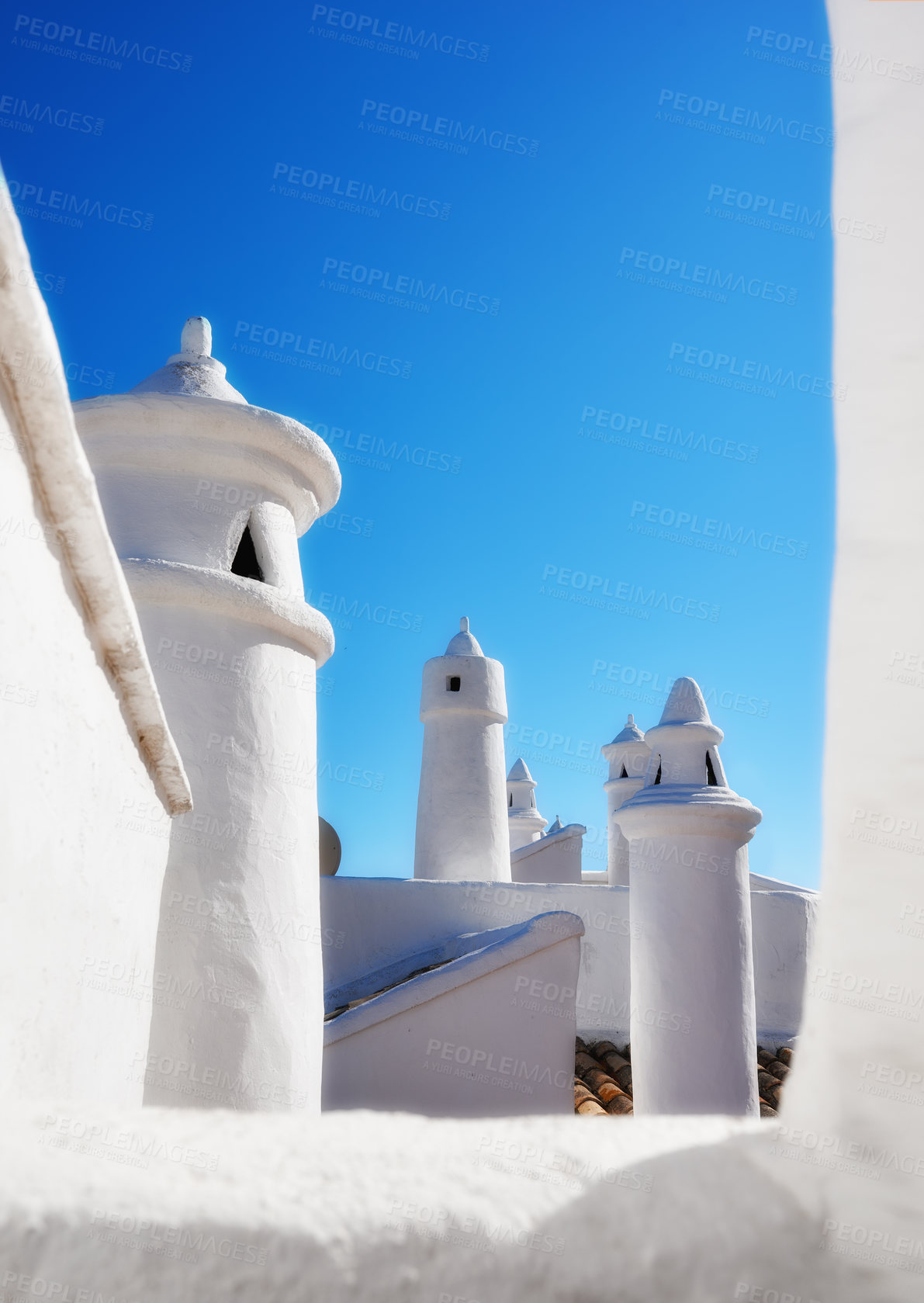 Buy stock photo Historic ventilation chimney on a roof of a vintage building. Traditional architecture airing system in a village. Exterior view of a rural home or house rooftop isolated on a blue sky background