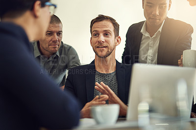 Buy stock photo Shot of a group of coworkers having a discussion in a boardroom