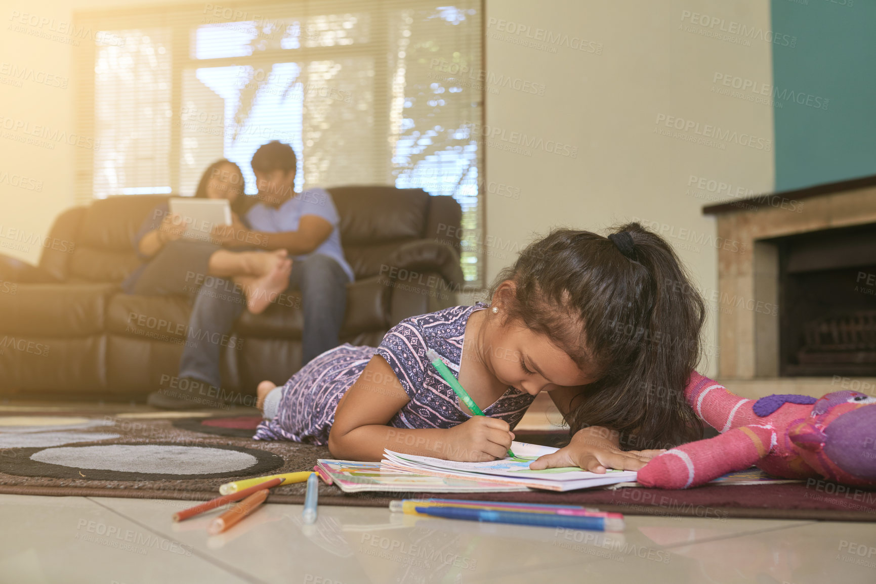 Buy stock photo Child, drawing and parents on sofa with tablet in home for relax or creative art as project, development or education. Mother, father and online streaming with daughter on carpet, colouring or rest