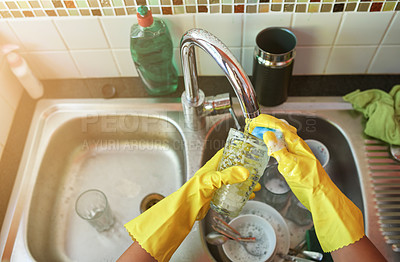 Buy stock photo Shot of dishes being washed at a kitchen sink