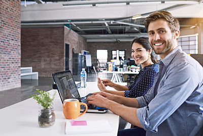 Buy stock photo Teamwork, office and portrait of man and woman at desk with laptop at creative agency, working on project together. Leadership, partnership and happy employees or business partner at design startup.