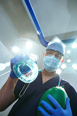 Buy stock photo Low angle shot of a surgeon in an operating room