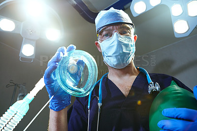 Buy stock photo Low angle shot of a surgeon in an operating room